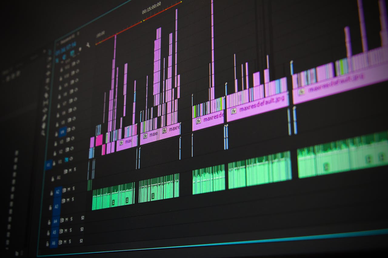 about-04 Close-up of a professional audio and video editing software interface with waveform displays.